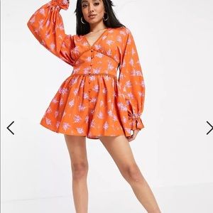 Super cute Orange Romper with button and stitching detail